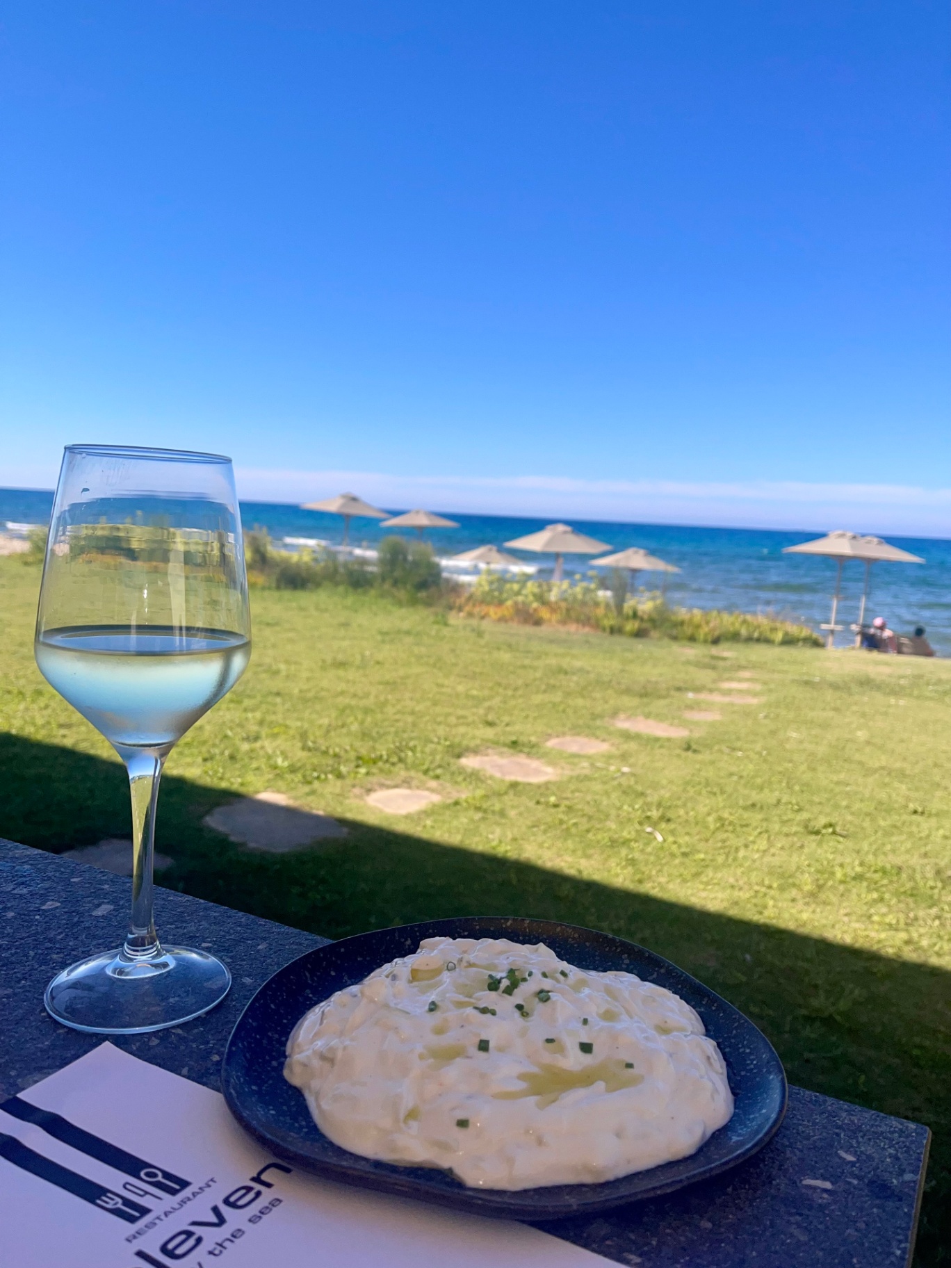 Glass of wine with sea view